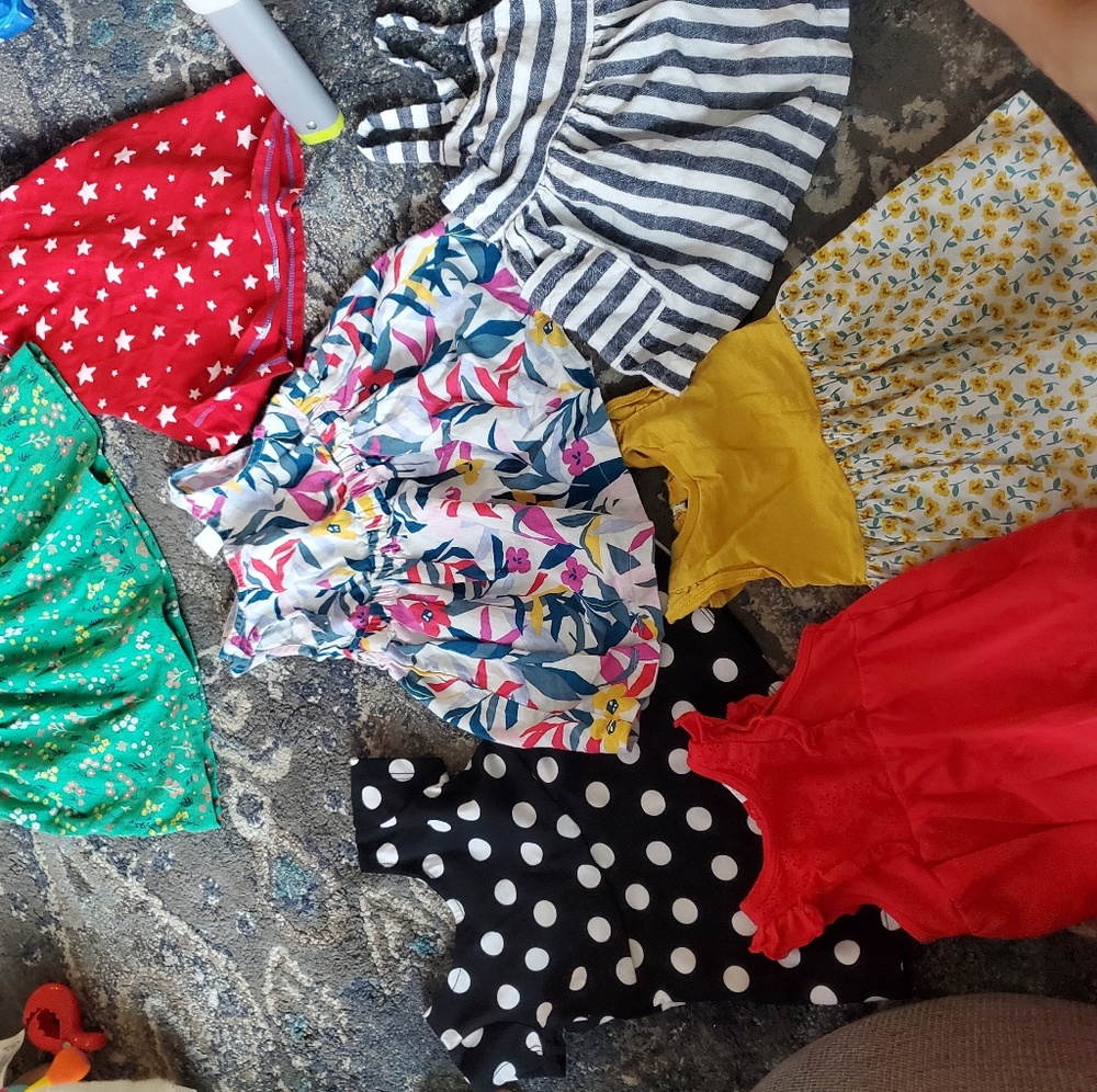 13 outfits. Dresses, rompers, two pieces outfits, shorts, pants.